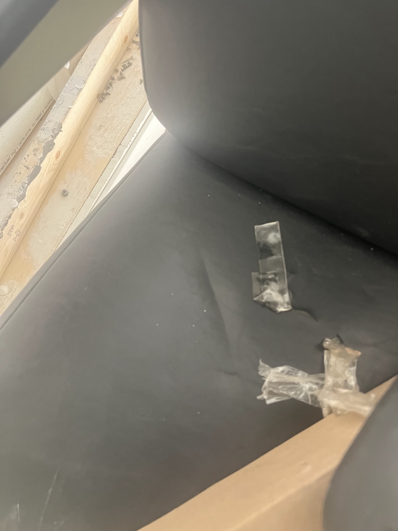 Torn black upholstery and clear tape on an ophthalmic chair.