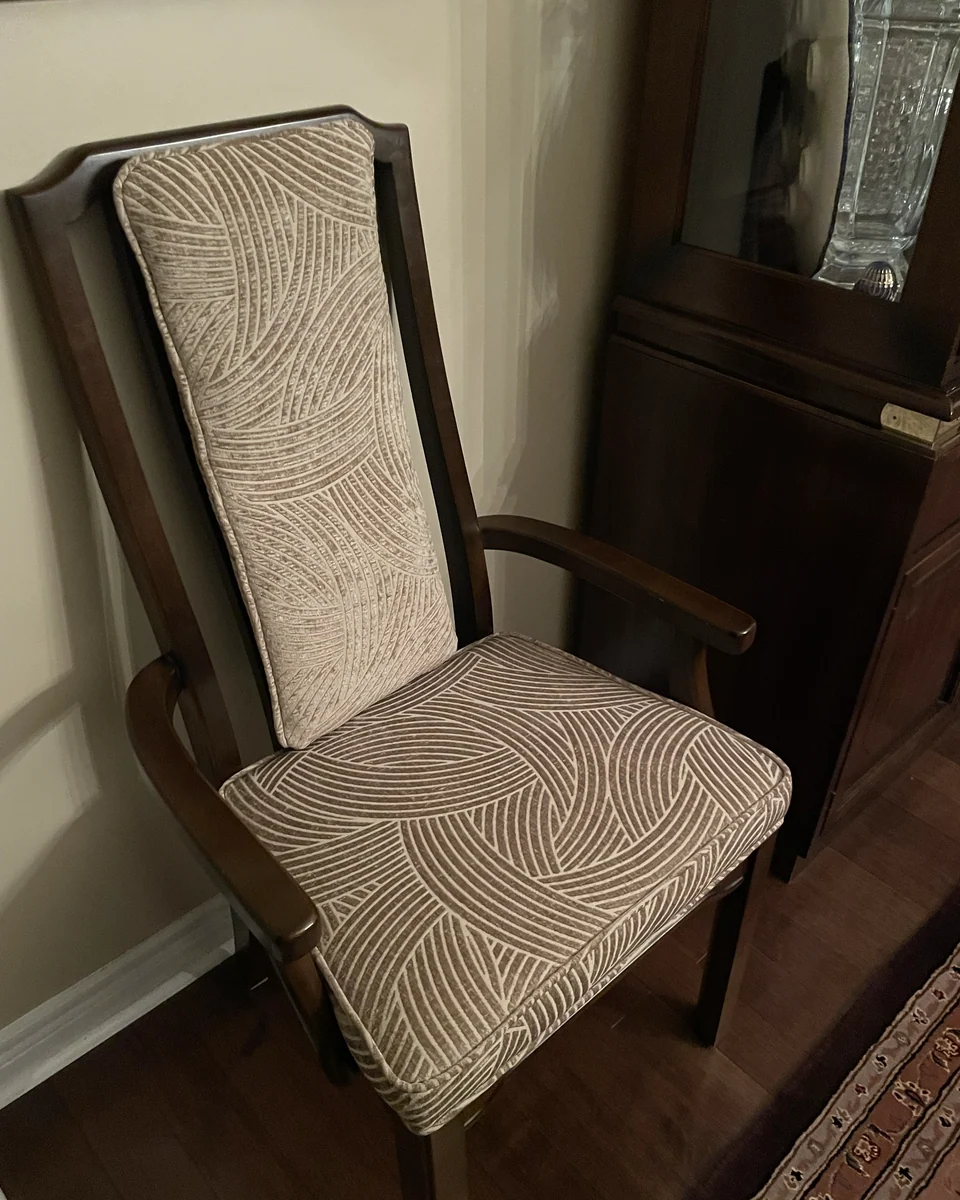 Coordinated dining chair restored by Nora’s Upholstery